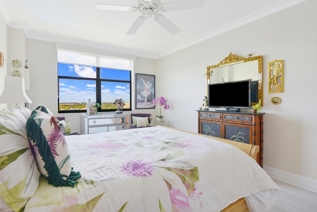 bedroom with ceiling fan, light hardwood / wood-style floors, and ornamental molding