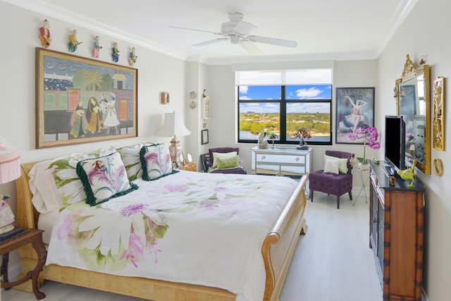 bedroom with ceiling fan, crown molding, and light hardwood / wood-style flooring