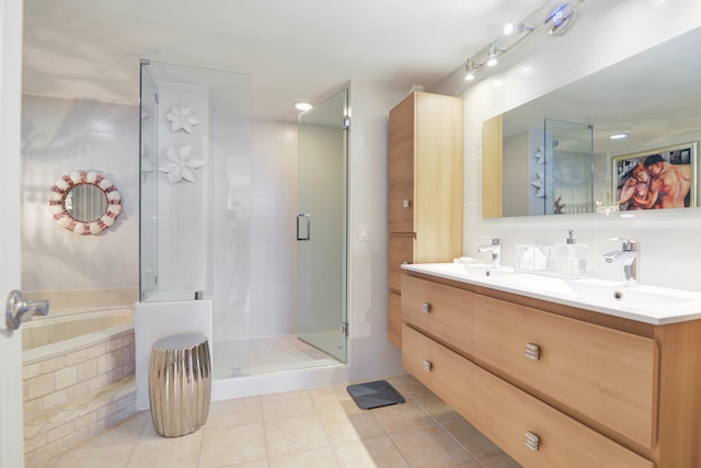 bathroom featuring tile patterned flooring, vanity, and independent shower and bath