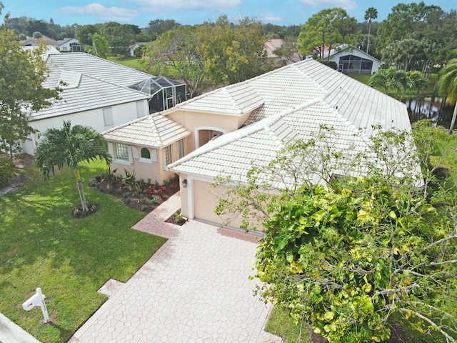 birds eye view of property with a water view