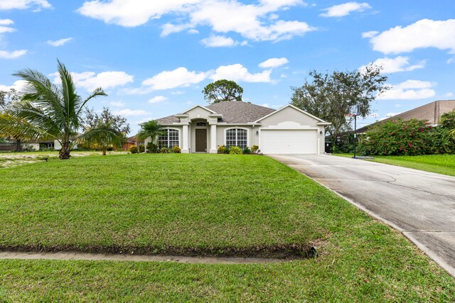 single story home with a garage and a front yard