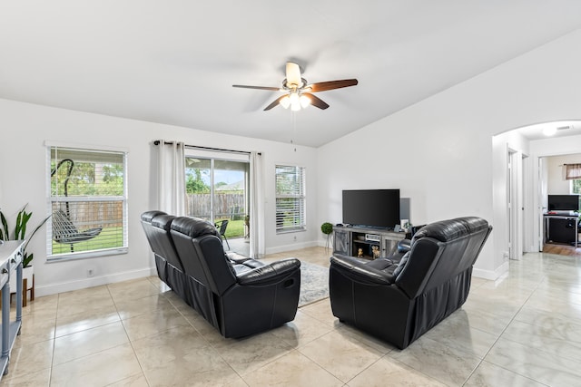 living room with ceiling fan and light tile patterned floors