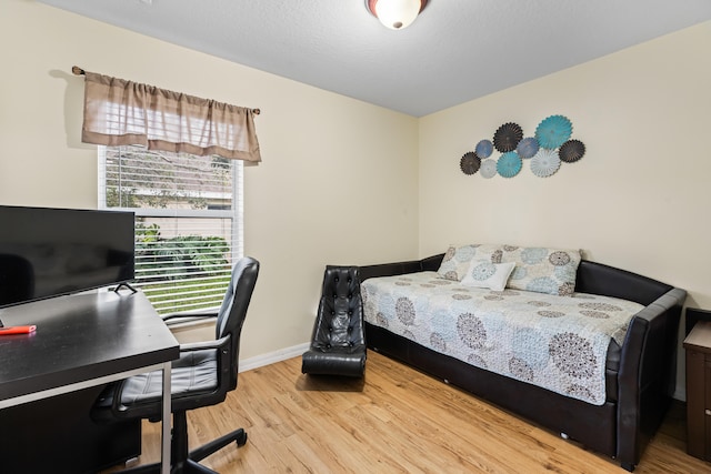 bedroom with light hardwood / wood-style floors