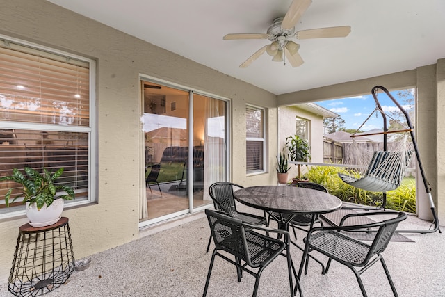 sunroom featuring ceiling fan