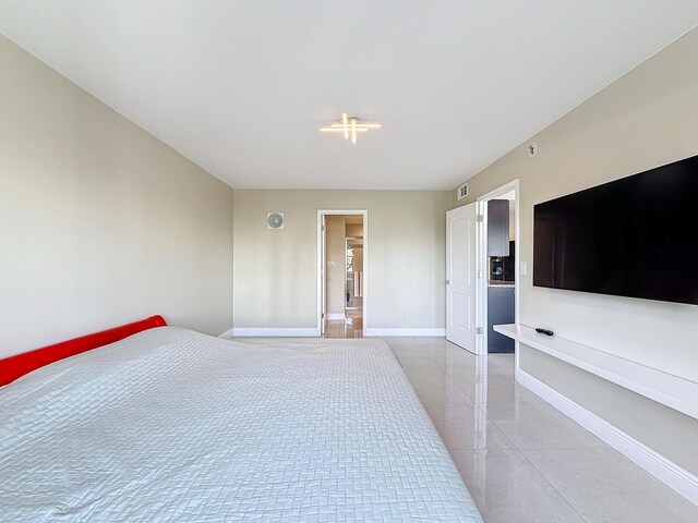 bedroom featuring connected bathroom