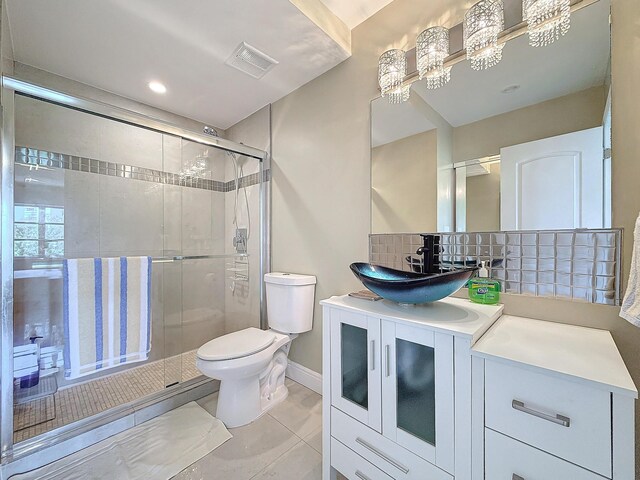 balcony with ceiling fan and a water view