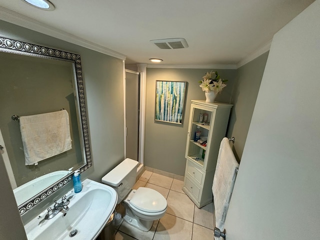 bathroom with sink, tile patterned flooring, toilet, a shower with shower door, and ornamental molding