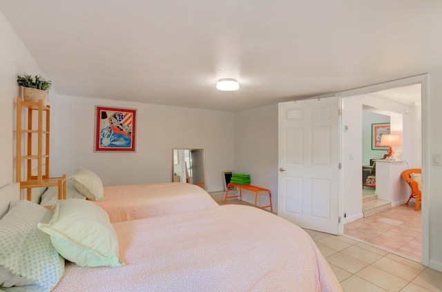 bedroom featuring light tile patterned flooring