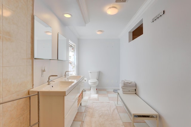 bathroom with toilet, vanity, tile patterned flooring, and crown molding