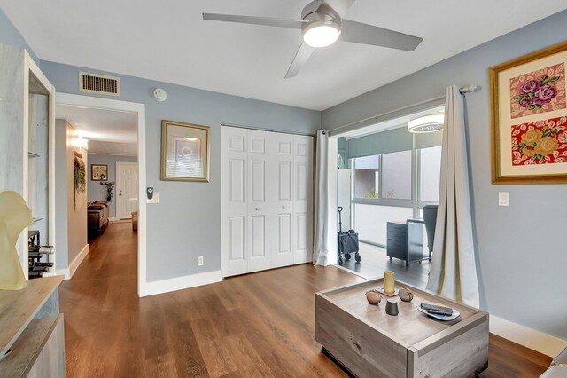 office space featuring ceiling fan and dark hardwood / wood-style floors