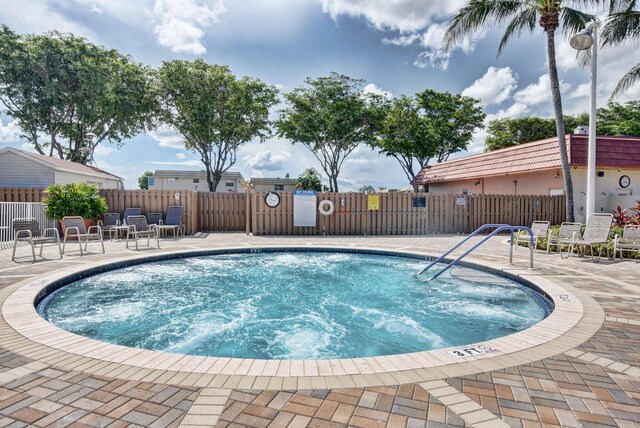 view of swimming pool featuring a patio