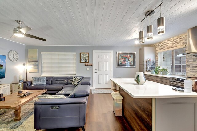 living room with ceiling fan, dark hardwood / wood-style flooring, and wooden ceiling