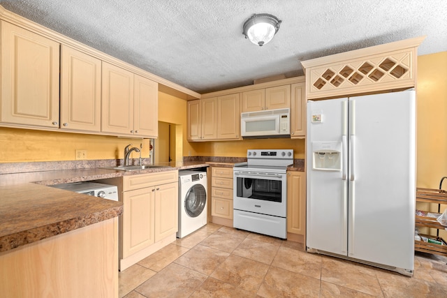 kitchen featuring washer / clothes dryer, a textured ceiling, white appliances, and sink