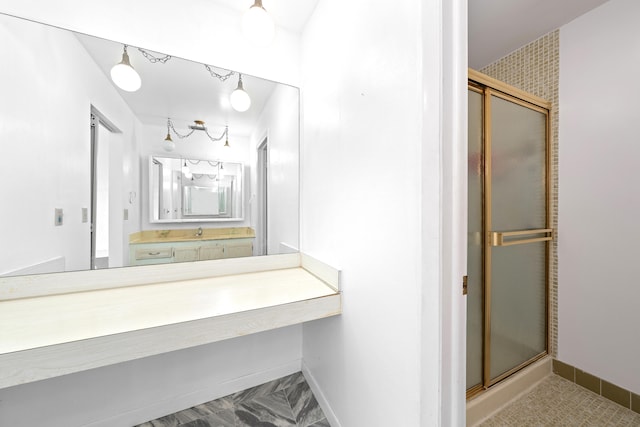 bathroom with vanity and an enclosed shower