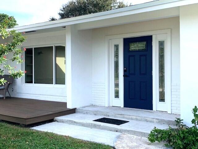 doorway to property featuring a deck