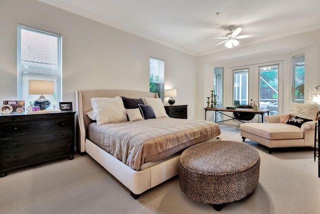 carpeted bedroom featuring french doors, ceiling fan, and crown molding