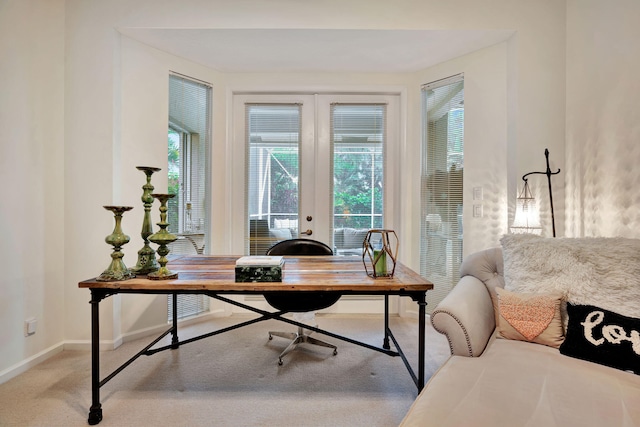 office space featuring french doors and light colored carpet