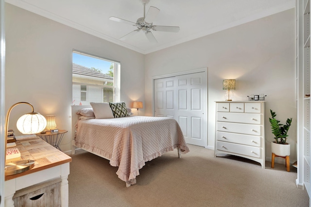 bedroom with carpet floors, ceiling fan, and a closet