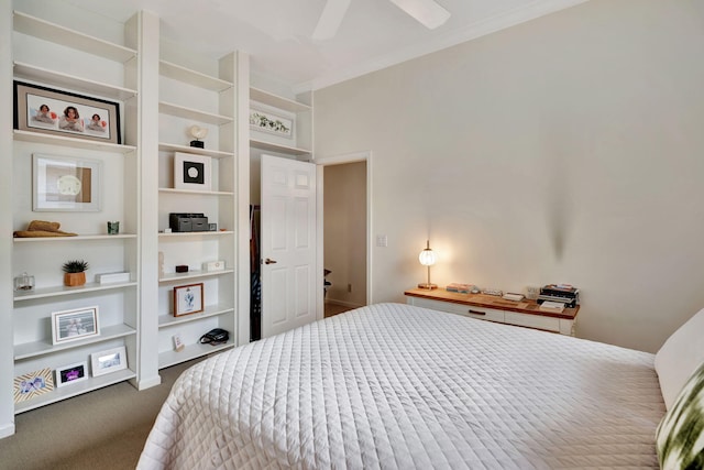 bedroom featuring ornamental molding, dark colored carpet, and ceiling fan