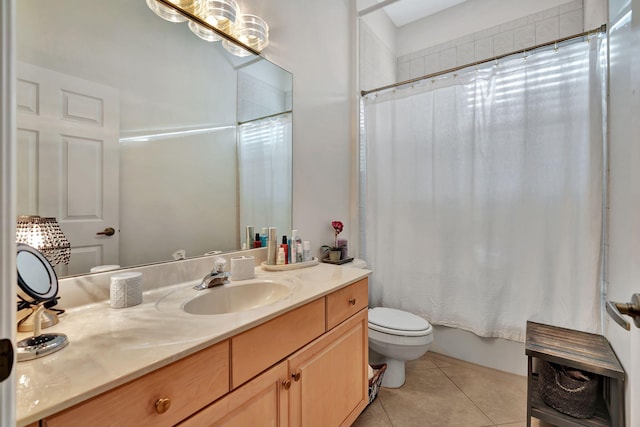 full bathroom featuring tile patterned flooring, vanity, shower / bath combo with shower curtain, and toilet