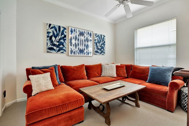 carpeted living room featuring ornamental molding and ceiling fan