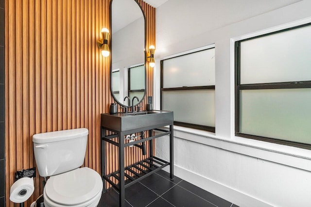 bathroom featuring toilet and tile patterned floors