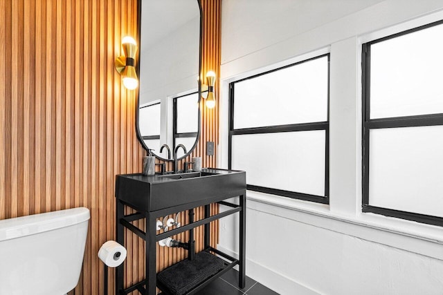 bathroom with tile patterned floors and toilet