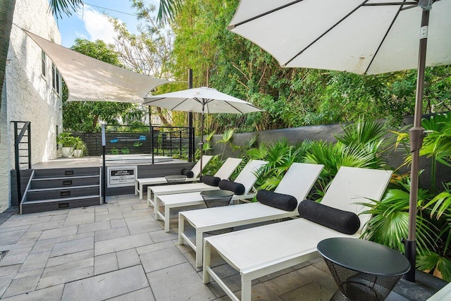 view of patio with a hot tub