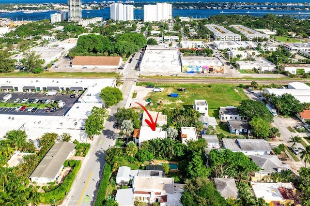 birds eye view of property with a water view