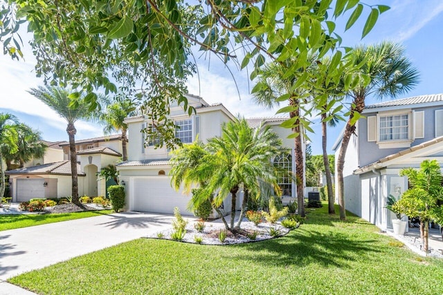 view of front of home featuring a garage and a front lawn