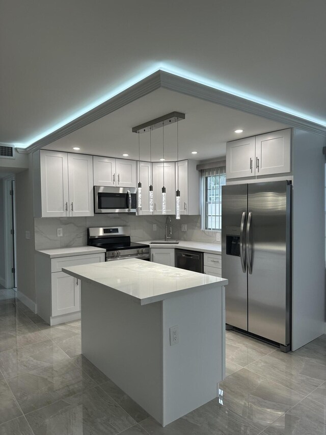 256 Suffolk Unit G, Boca Raton, FL 33434 - kitchen with stainless steel appliances, light marble finish flooring, decorative backsplash, light countertops, and recessed lighting