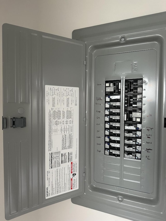 256 Suffolk Unit G, Boca Raton, FL 33434 - utility room featuring electric panel