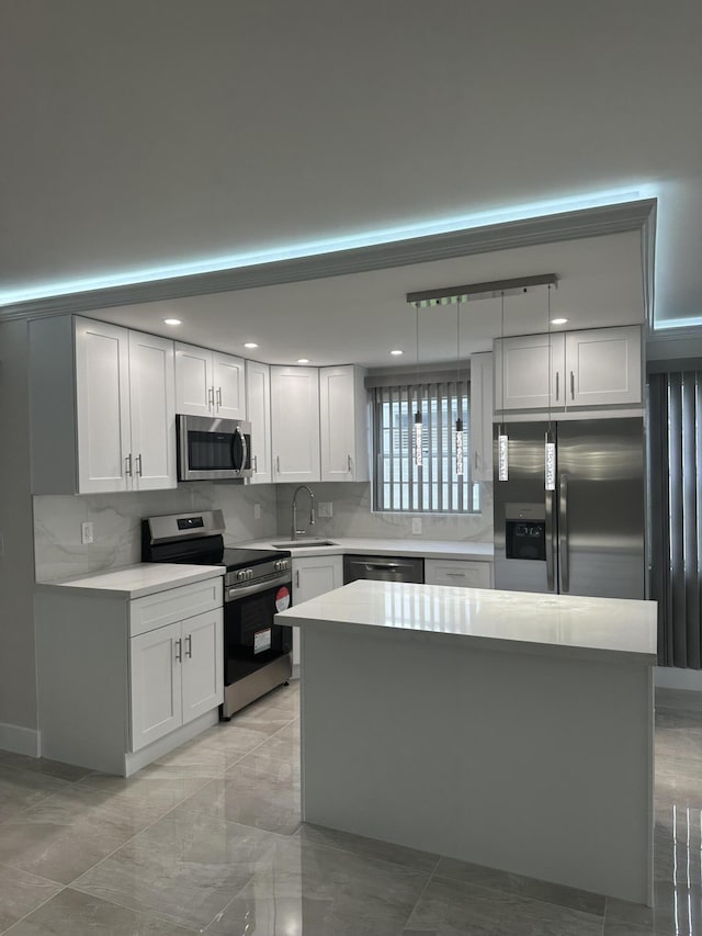 256 Suffolk Unit G, Boca Raton, FL 33434 - kitchen with stainless steel appliances, a sink, backsplash, light countertops, and recessed lighting