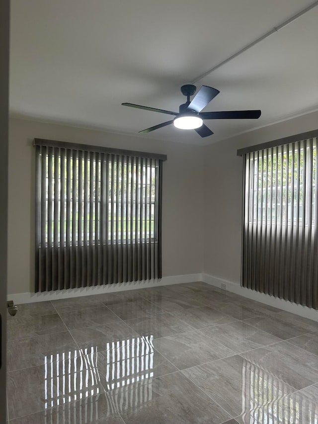 spare room featuring ceiling fan