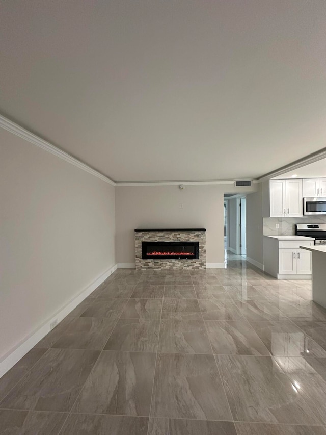 unfurnished living room featuring a fireplace and crown molding