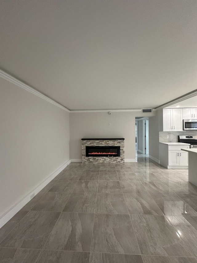 256 Suffolk Unit G, Boca Raton, FL 33434 - unfurnished living room featuring crown molding, light marble finish floors, baseboards, and a stone fireplace