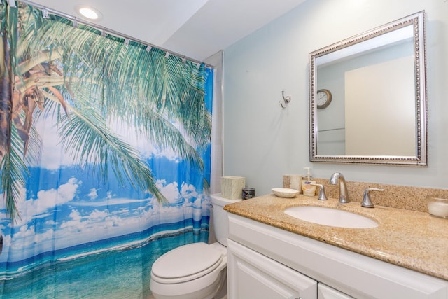 bathroom featuring toilet and vanity