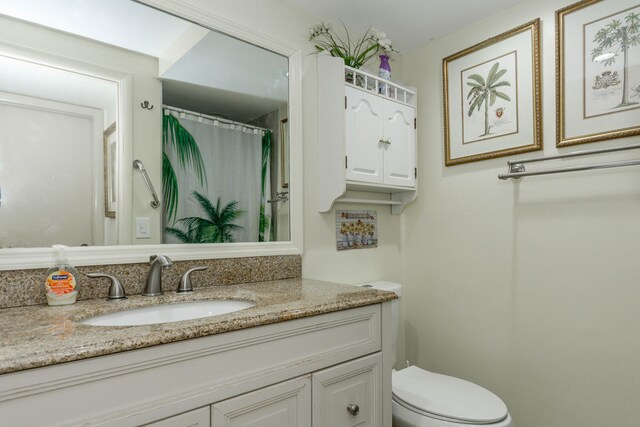 294 Burgundy Unit G, Delray Beach, FL 33484 - full bathroom featuring vanity, toilet, and a shower with curtain