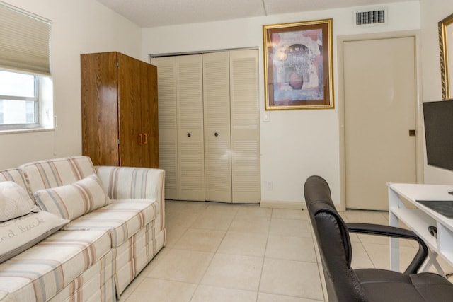 office with light tile patterned flooring