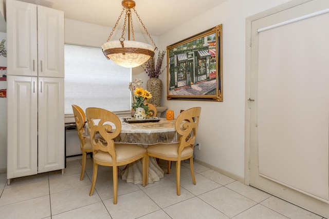 dining space with light tile patterned floors