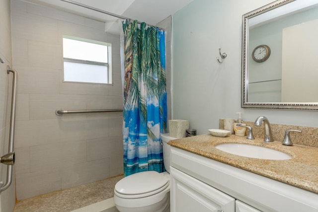 bathroom with walk in shower, vanity, and toilet