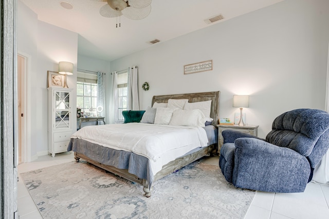 bedroom featuring ceiling fan and light tile patterned flooring