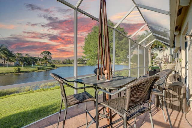 sunroom / solarium with a water view