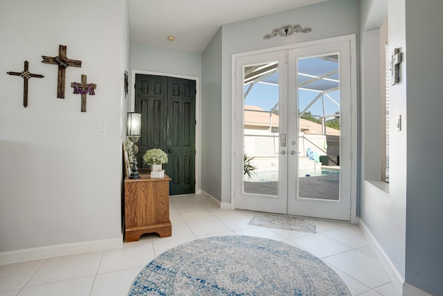 entryway with french doors and light tile patterned floors