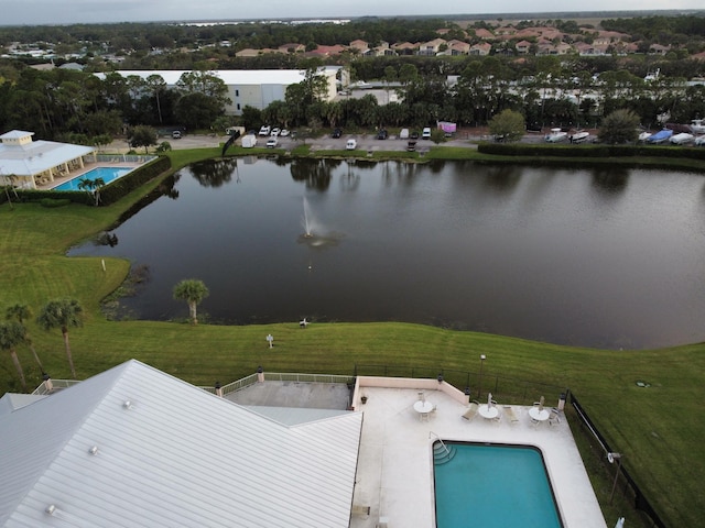 birds eye view of property with a water view