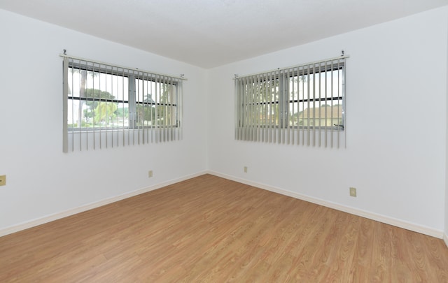 spare room with light hardwood / wood-style floors