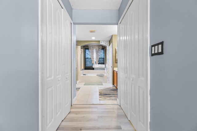 hall featuring light wood-type flooring