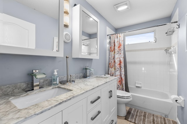 full bathroom featuring toilet, shower / bath combo, vanity, and tile patterned floors