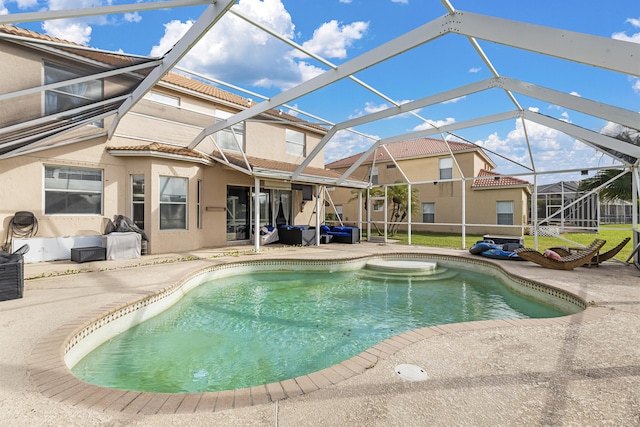 view of pool with a lanai and a patio area