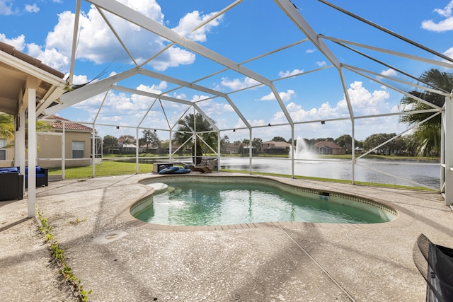 view of swimming pool featuring a lanai, a patio, and a water view